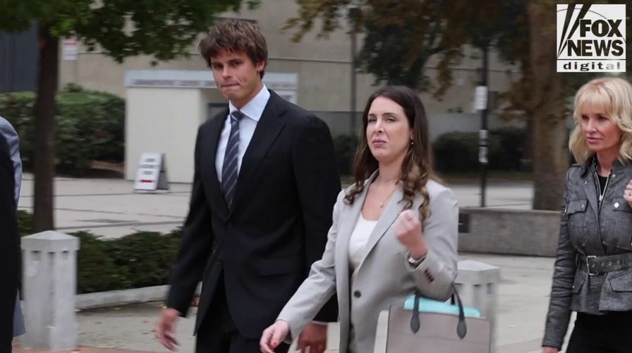 Fraser Bohm leaves tribunal with his family