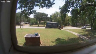 Car slams into Amazon delivery truck with driver still inside