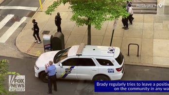 Cop throws ball with school kids