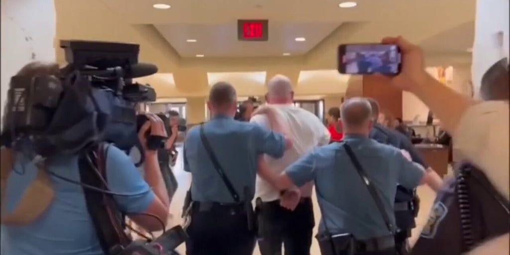 Satanic leader shouts 'Hail Satan' as he's arrested at Kansas State House