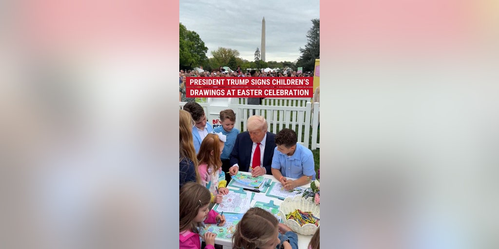 President Trump signs children's drawings at Easter celebration