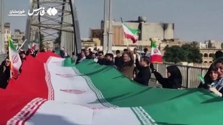 Iranians in Khuzestan province form a human chain at bridge