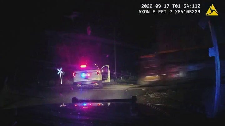 Bodycam footage shows train hit Colorado officer’s car with suspect inside