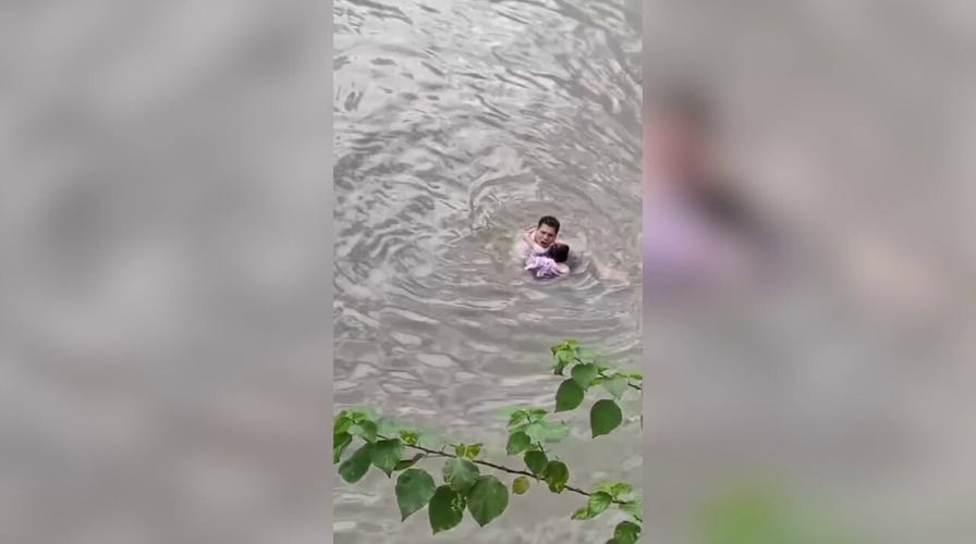 Fast-flowing river rescue: Man jumps in after floating little girl