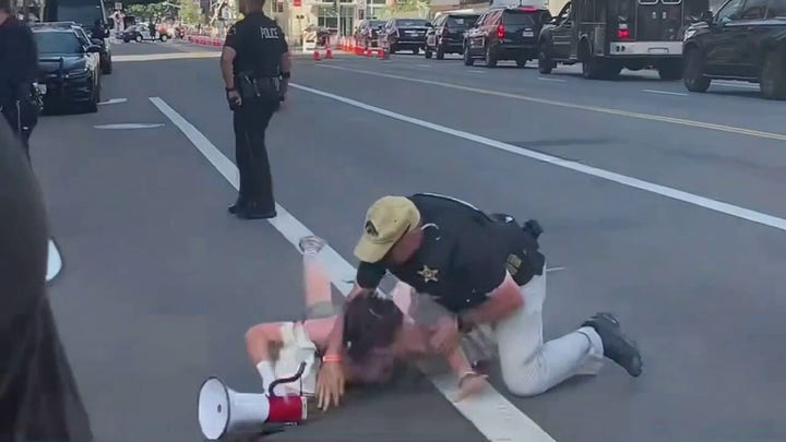 Biden protester tackled after waking in front of motorcade 