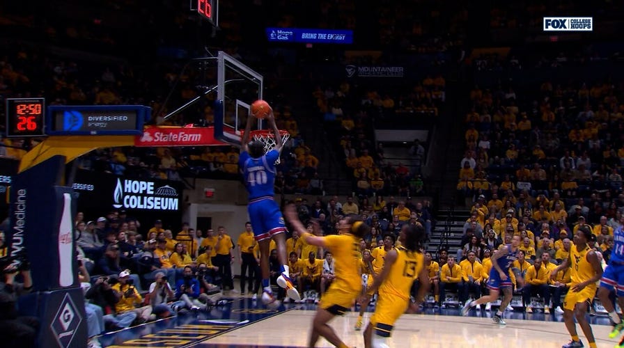 Flory Bidunga throws down alley-oop on the fastbreak, extending Kansas' lead over West Virginia