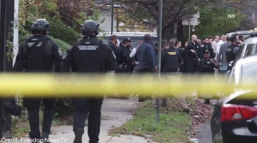 New Jersey law enforcement on the scene where multiple officers were shot by a gunman in Newark, New Jersey