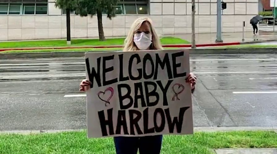 Grandparents greet newborn baby from outside hospital amid coronavirus pandemic