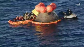 Artemis II moon mission astronauts exit space capsule