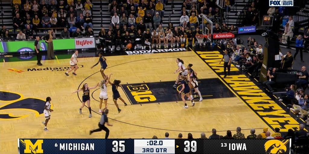 Kylie Feuerbach hits TOUGH step back three at the buzzer, extending Iowa's lead over Michigan
