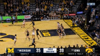 Kylie Feuerbach hits TOUGH step back three at the buzzer, extending Iowa's lead over Michigan