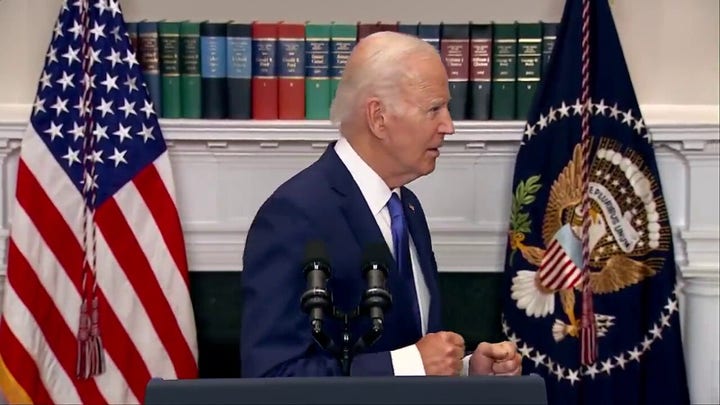 Biden wanders away from podium as reporter asks about Chinese hackers