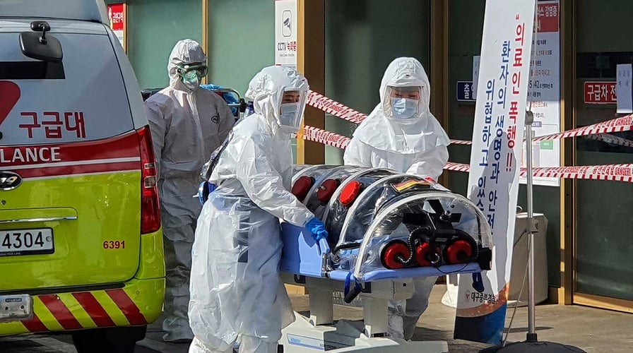 China curbs optimism as coronavirus cases rise in South Korea