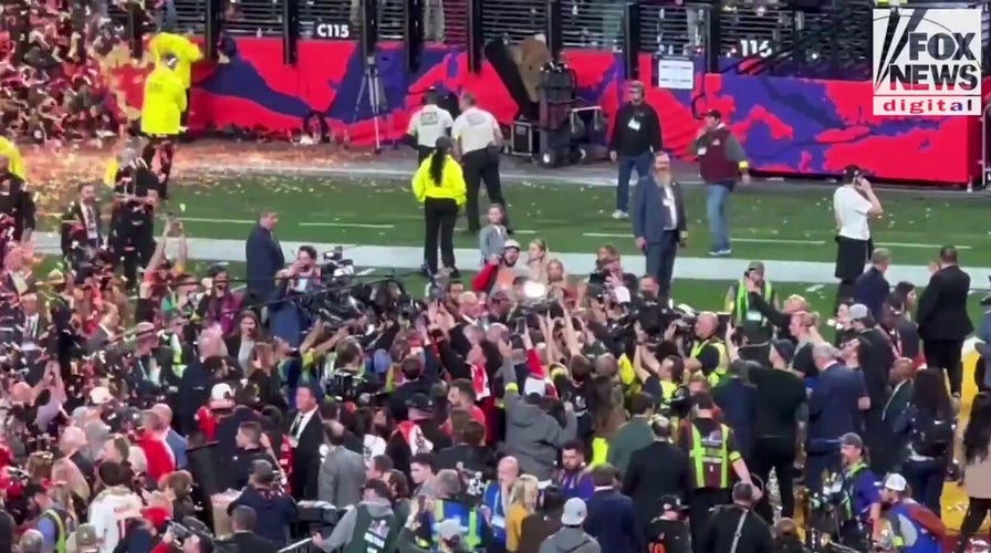 Swift kisses boyfriend on field after Super Bowl win
