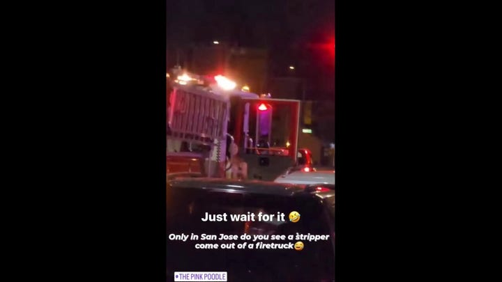 Bikini-clad woman exits fire truck in San José , CA