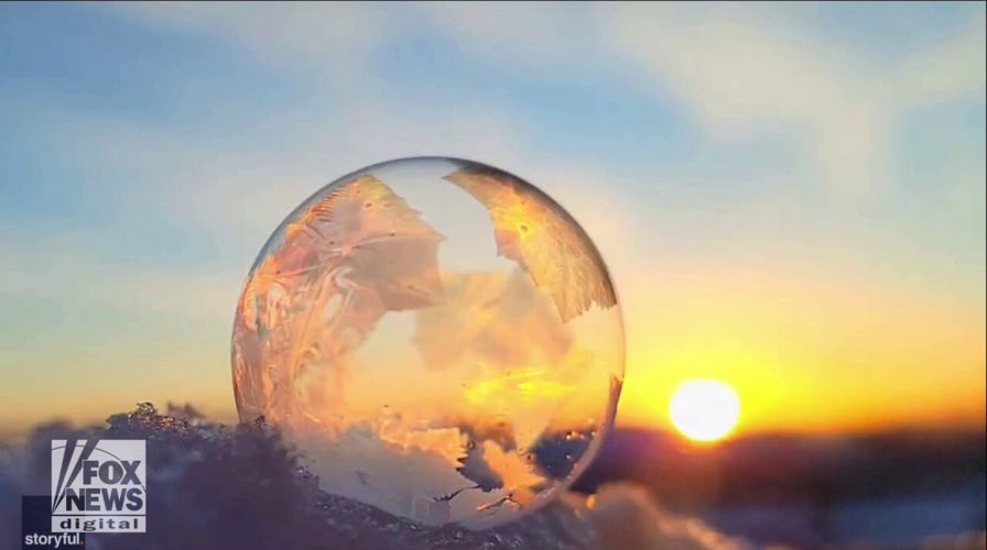 Mesmerizing! Watch cool ice crystals form on a soap bubble amid freezing temperatures