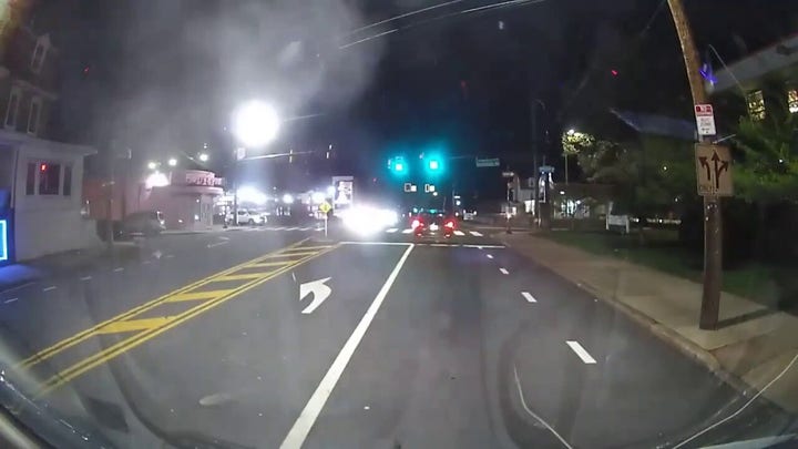 Philadelphia video shows armed suspects approaching car before driver opens fire