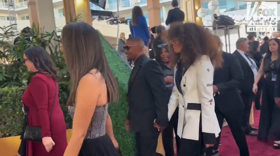 Jamie Foxx walks the red carpet at the 2025 Golden Globe Awards