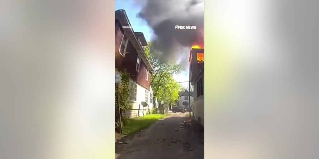 SEE IT: Officer catches baby thrown from burning house window