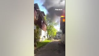 SEE IT: Officer catches baby thrown from burning house window