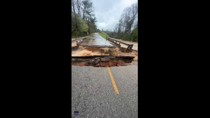 Bridge cracks and crumbles into Alabama creek following heavy rain
