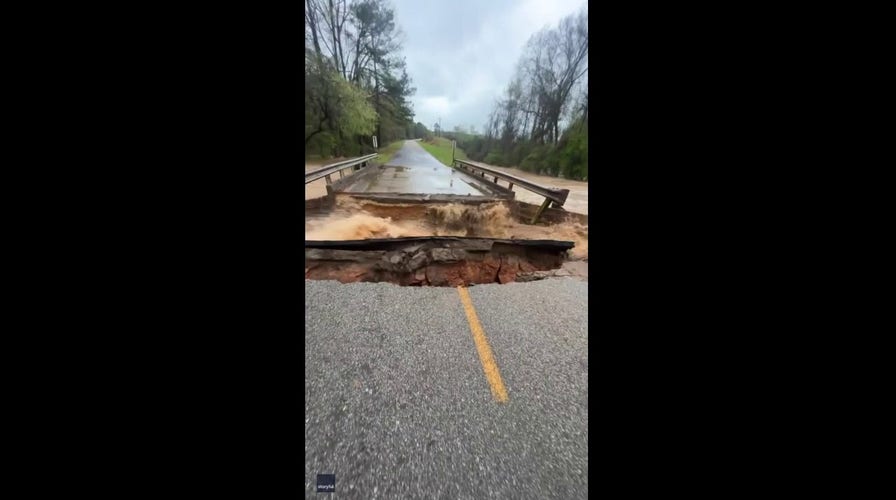 Bridge cracks and crumbles into Alabama creek following heavy rain
