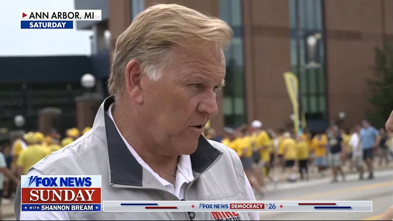 Football and politics merge at Michigan tailgate as Senate candidates mingle with attendees