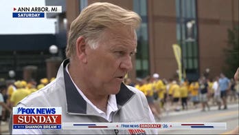 Football and politics merge at Michigan tailgate as Senate candidates mingle with attendees