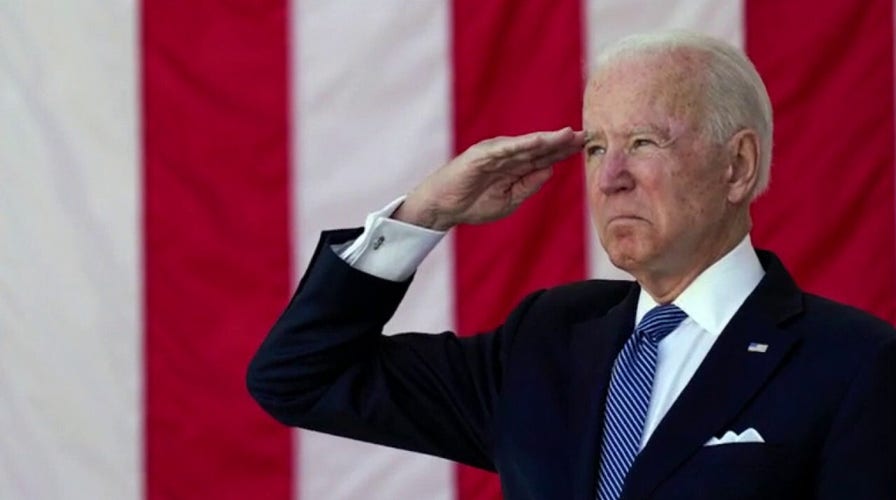 Biden pays tribute to fallen soldiers, issues stark warning on American democracy