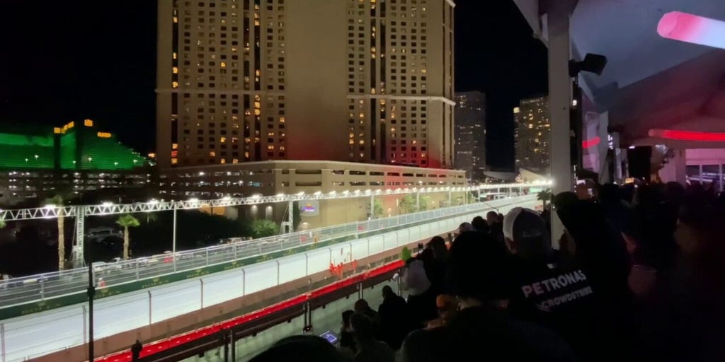 F1 drivers zoom down the straightaway at the Las Vegas Grand Prix