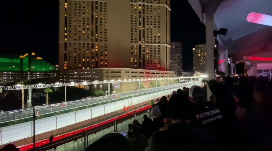 F1 drivers zoom down the straightaway at the Las Vegas Grand Prix