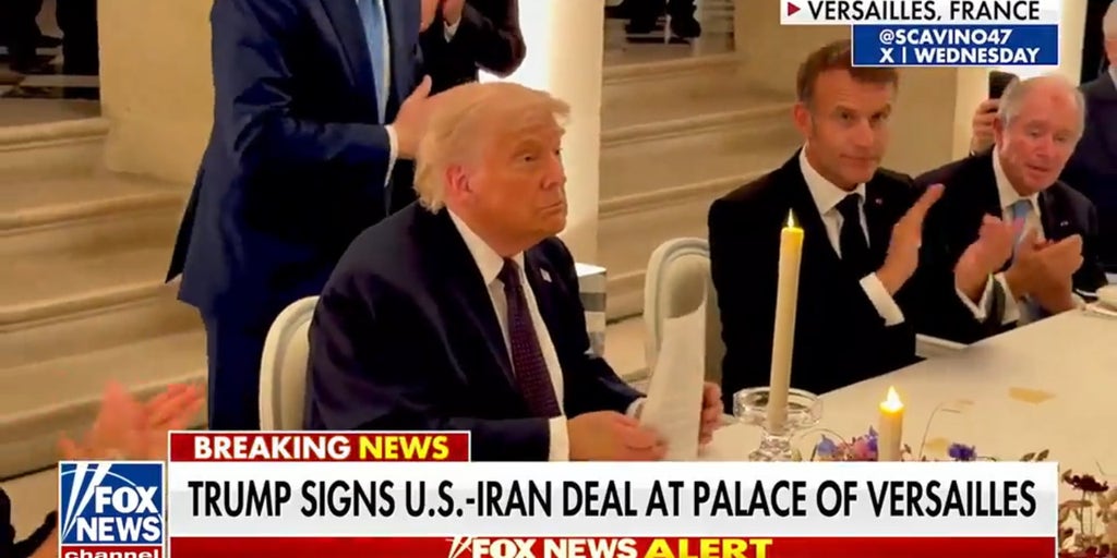 Trump signs Iran deal, defends against criticism of new memorandum