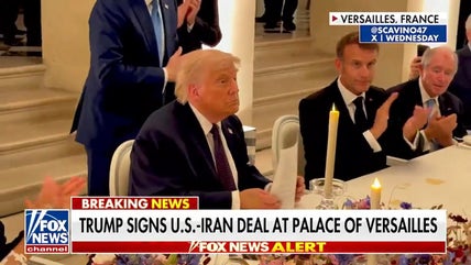 Trump signs Iran deal, defends against criticism of new memorandum