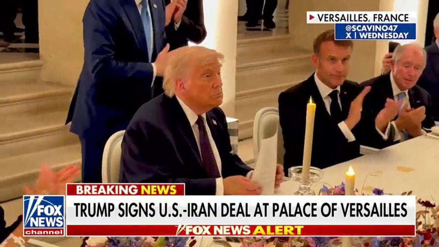 Trump signs Iran deal, defends against criticism of new memorandum
