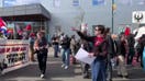 Protesters march through South Minneapolis, carry political signs