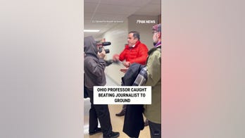 Professor caught beating journalist to ground