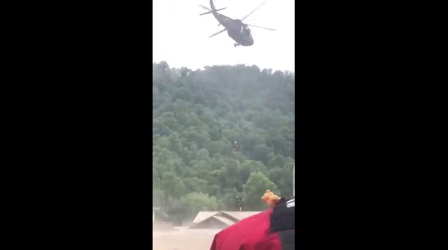 Kentucky flooding: An elderly woman is rescued in a dramatic video