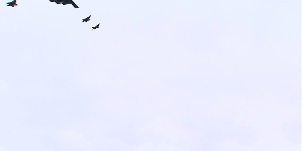 B-2 stealth bomber and F-35 jets buzz overhead as Trump greets Putin