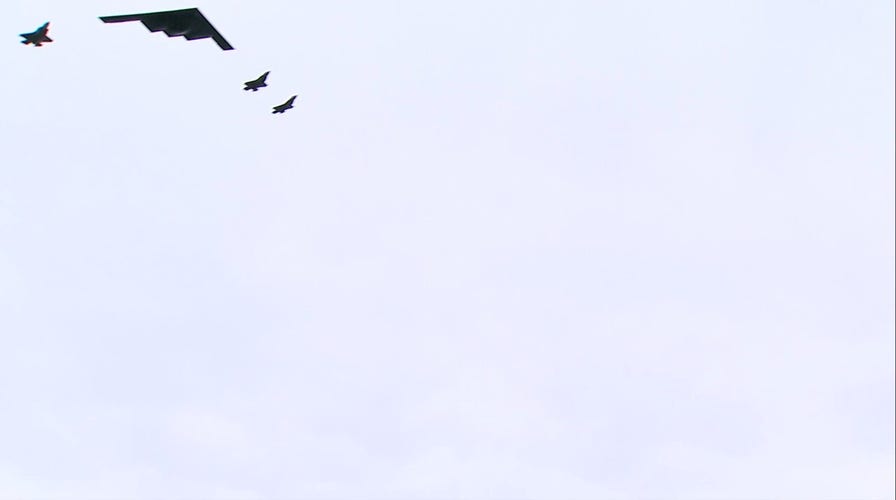 B-2 stealth bomber and F-35 jets buzz overhead as Trump greets Putin
