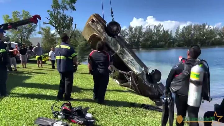 Miami-Dade police department divers dredge up 32 cars from a lake in Doral, Florida