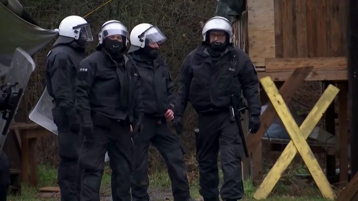 German police remove climate protesters from abandoned village