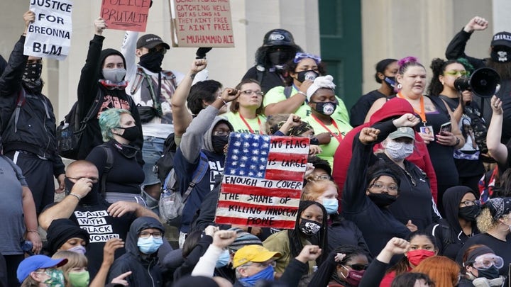 Two Louisville police officers shot amid riots