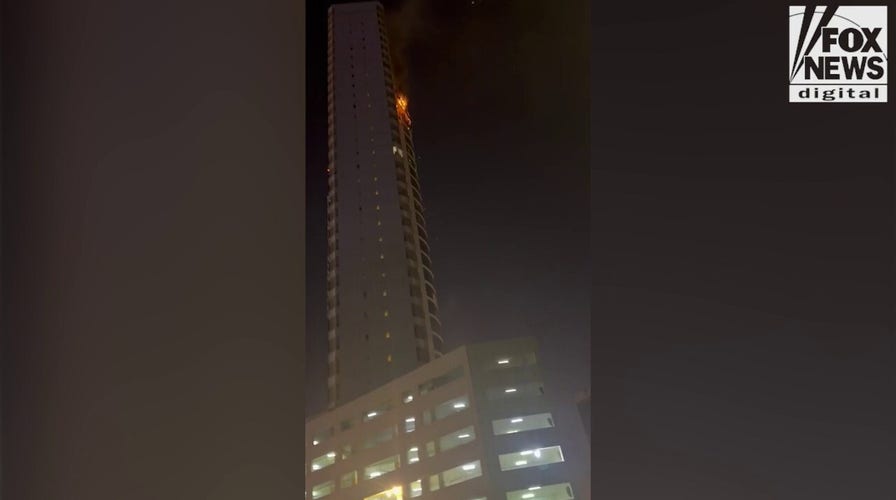 Stranded American recounts Iranian drone striking Bahrain high-rise while he was inside