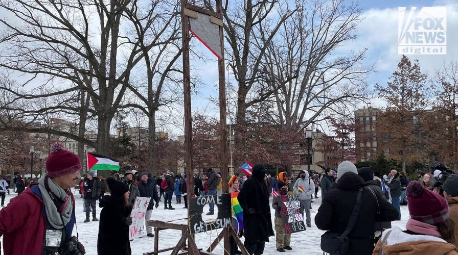 Hundreds of anti-Trump protesters rally and march near inauguration site