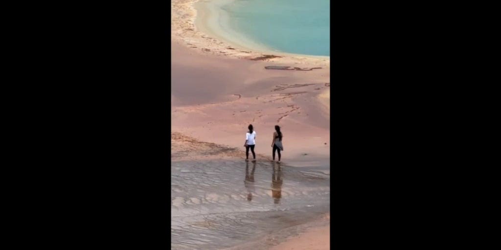 Tourists caught on video walking across deadly hot spring despite warnings
