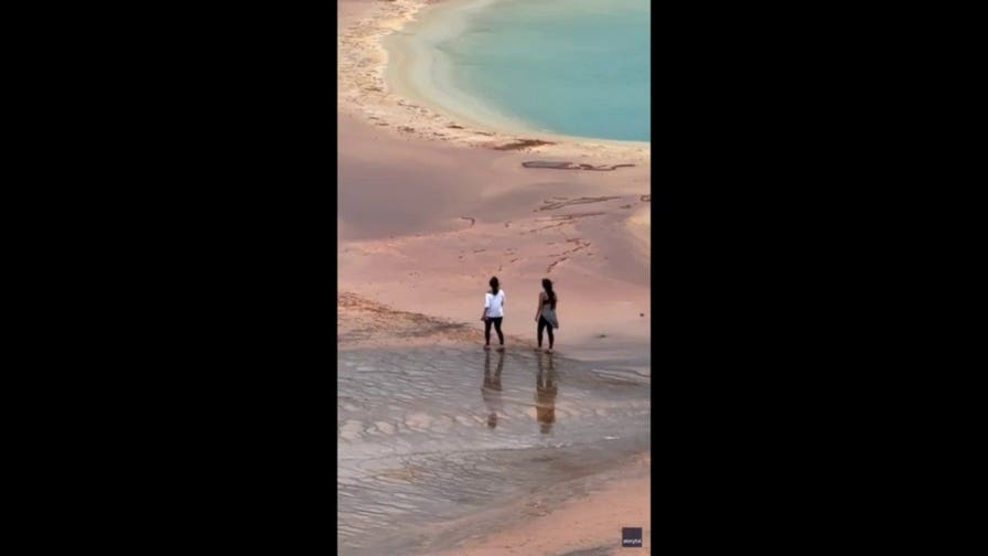 Tourists caught on video walking across deadly hot spring despite warnings