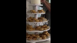 Money-savvy bride replaces traditional wedding cake with doughnuts, dividing the internet