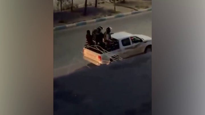 Gunfire rings out in Tehran; Hezbollah is seen with machine guns