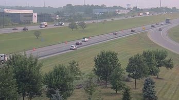 Ohio shoplifting suspect leaps onto woman's moving car in wild interstate escape
