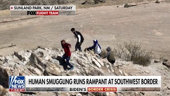 Migrants picked up by human smugglers in broad daylight